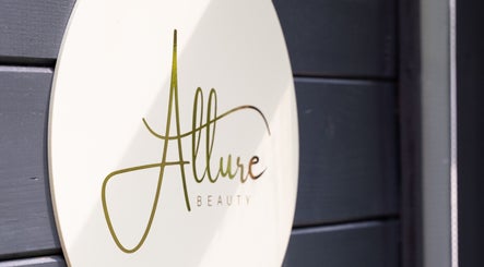 Allure Prestige Beauty sign in Worsley, England, GB displayed on a sleek wall.