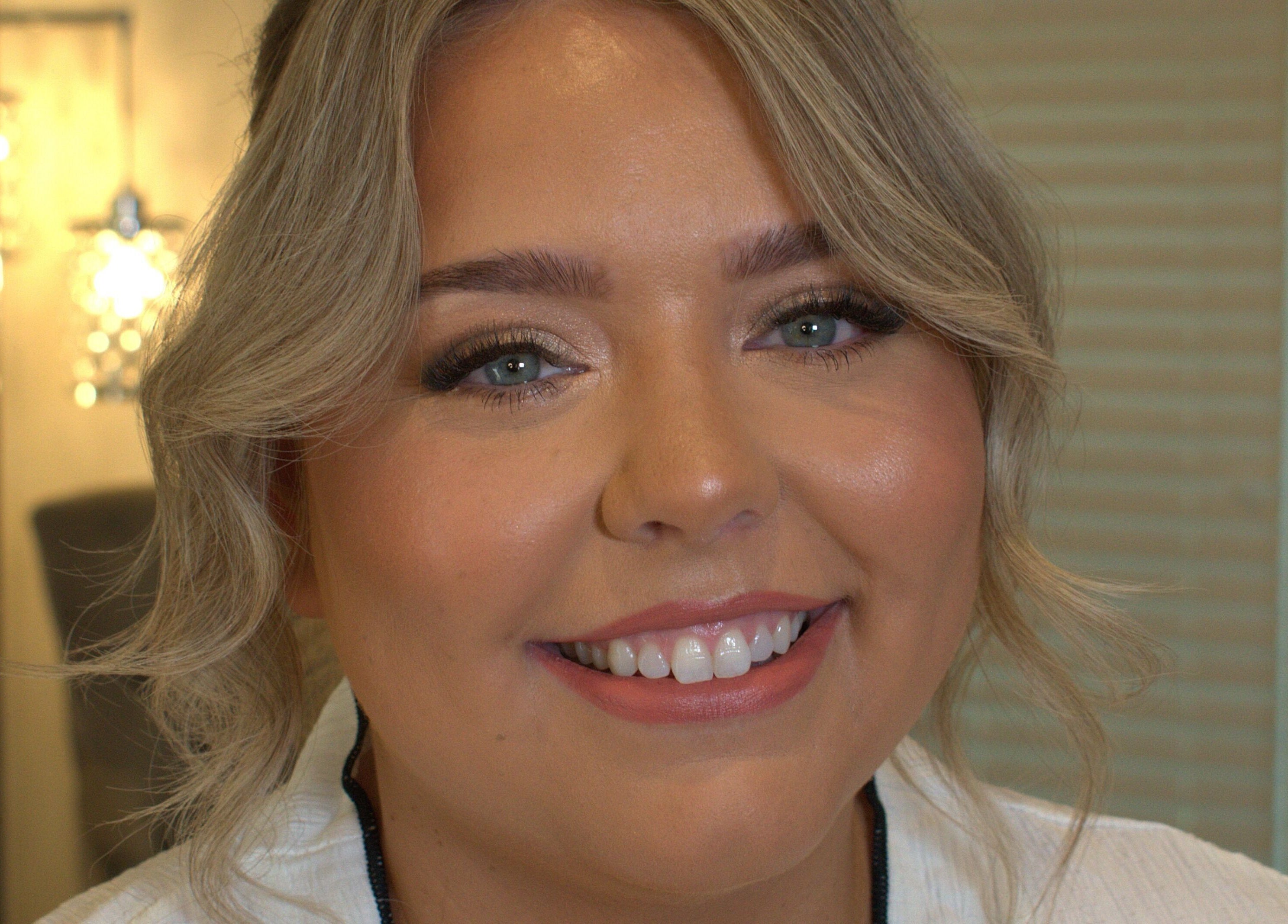 Close-up of a smiling woman showcasing flawless makeup at Make Up by Simone, Wickford, England, GB.