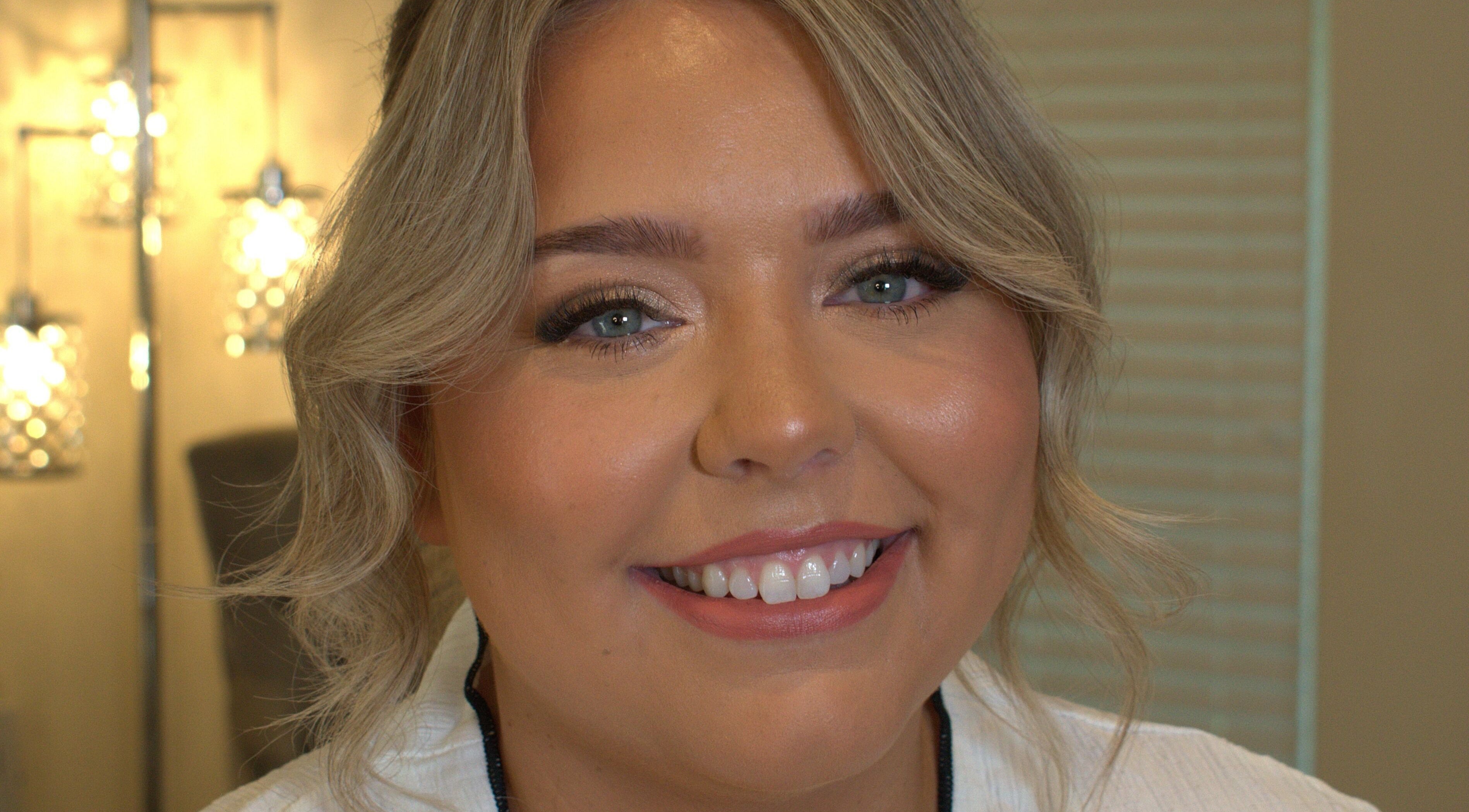 Close-up of a smiling woman showcasing flawless makeup at Make Up by Simone, Wickford, England, GB.