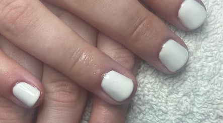 Elegant white manicured nails showcased at Tashie’s Beauty Pod, Warfield, England, GB.