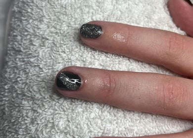 Stylish black and glitter nail art at Tashie’s Beauty Pod in Warfield, England, GB.
