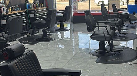Modern barber chairs at Another Level Barbershop in Baldwin, New York, US, with sleek interior design.