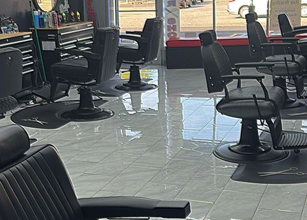 Modern interior of Another Level Barbershop, Baldwin, New York, US, featuring stylish barber chairs.