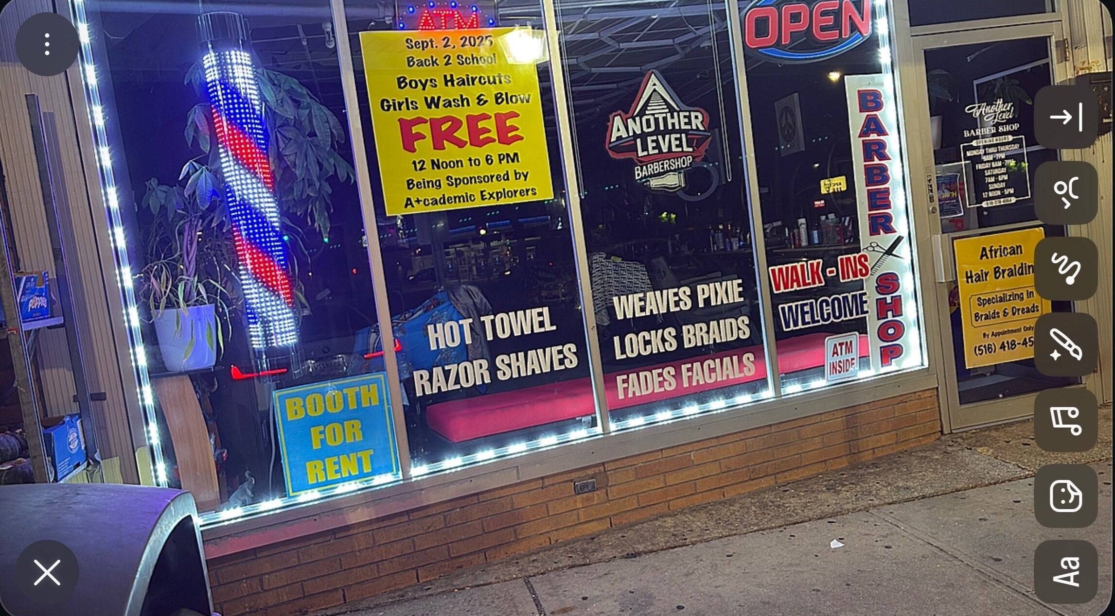 Colorful storefront of Another Level Barbershop in Baldwin, New York, US featuring services and promotions.