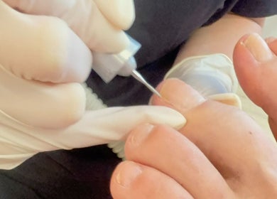 Professional pedicure treatment at Nica Beauty on Hong Kong Island, HK, focusing on toenail care.