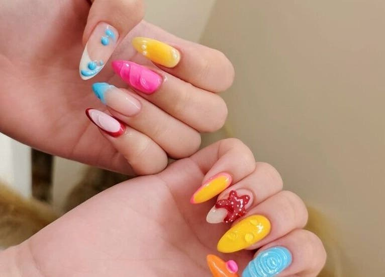 Creative nail art design at Nica Beauty on Hong Kong Island, HK, showcasing colorful and unique styles.
