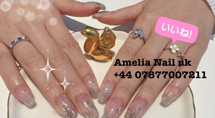 Stylish glitter manicure with elegant rings at Amelia Beauty, Manchester, England, GB.