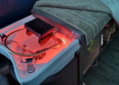 Heated spa bed at Aura10 in Long Hanborough, GB, ready for wellness treatments.