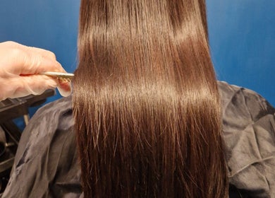 Professional hair treatment at Aura10 in Long Hanborough, GB, showcasing shiny, smooth hair results.
