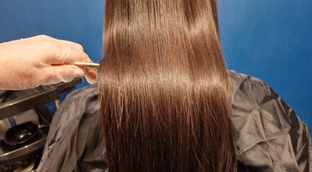 Professional hair treatment at Aura10 in Long Hanborough, GB, showcasing shiny, smooth hair results.