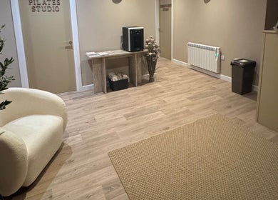 Welcoming foyer with soft chair and Pilates studio door at Revival Wellbeing, Thurso, Scotland, GB.