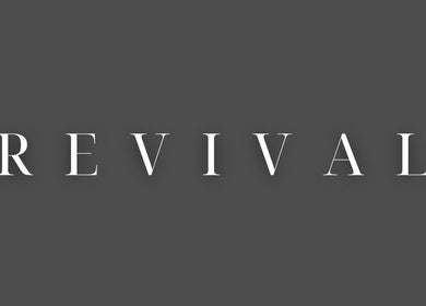 Sophisticated Revival Wellbeing signboard in Thurso, Scotland, GB, featuring elegant white font on gray background.