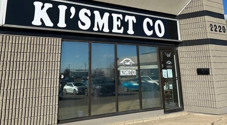 Exterior of Jolene Funk RMT in Saskatoon, Saskatchewan, CA with prominent Kismet Co sign.