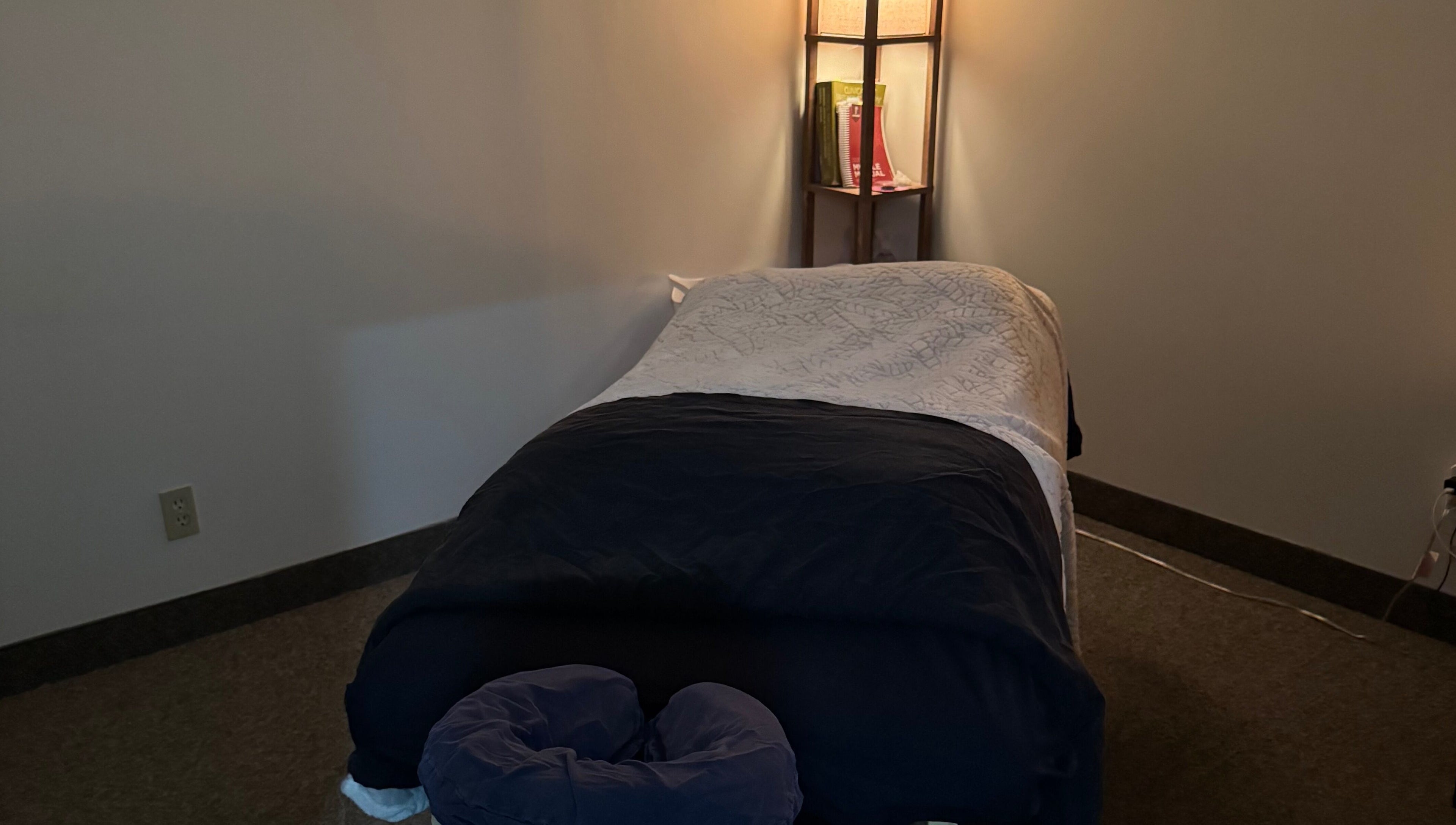 Tranquil massage room at Jolene Funk RMT in Saskatoon, Saskatchewan, CA, featuring a comfortable massage table.