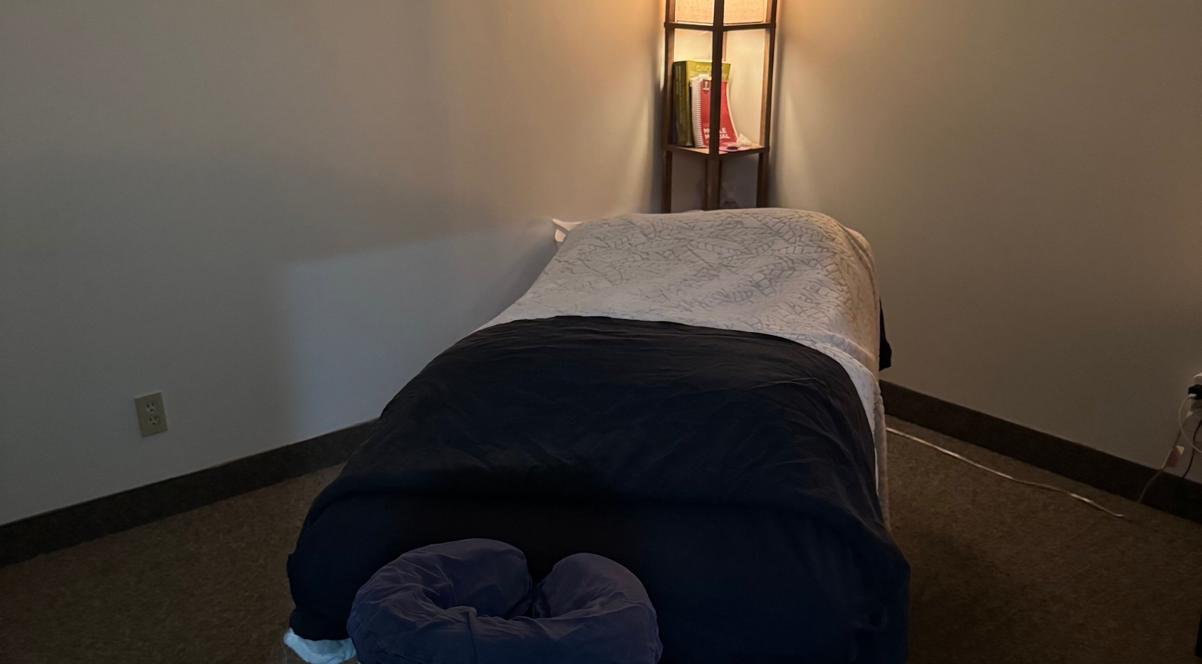 Tranquil massage room at Jolene Funk RMT in Saskatoon, Saskatchewan, CA, featuring a comfortable massage table.