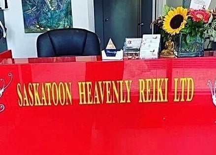 Reception desk at Jolene Funk RMT, Saskatoon, Saskatchewan, CA adorned with flowers and welcoming decor.