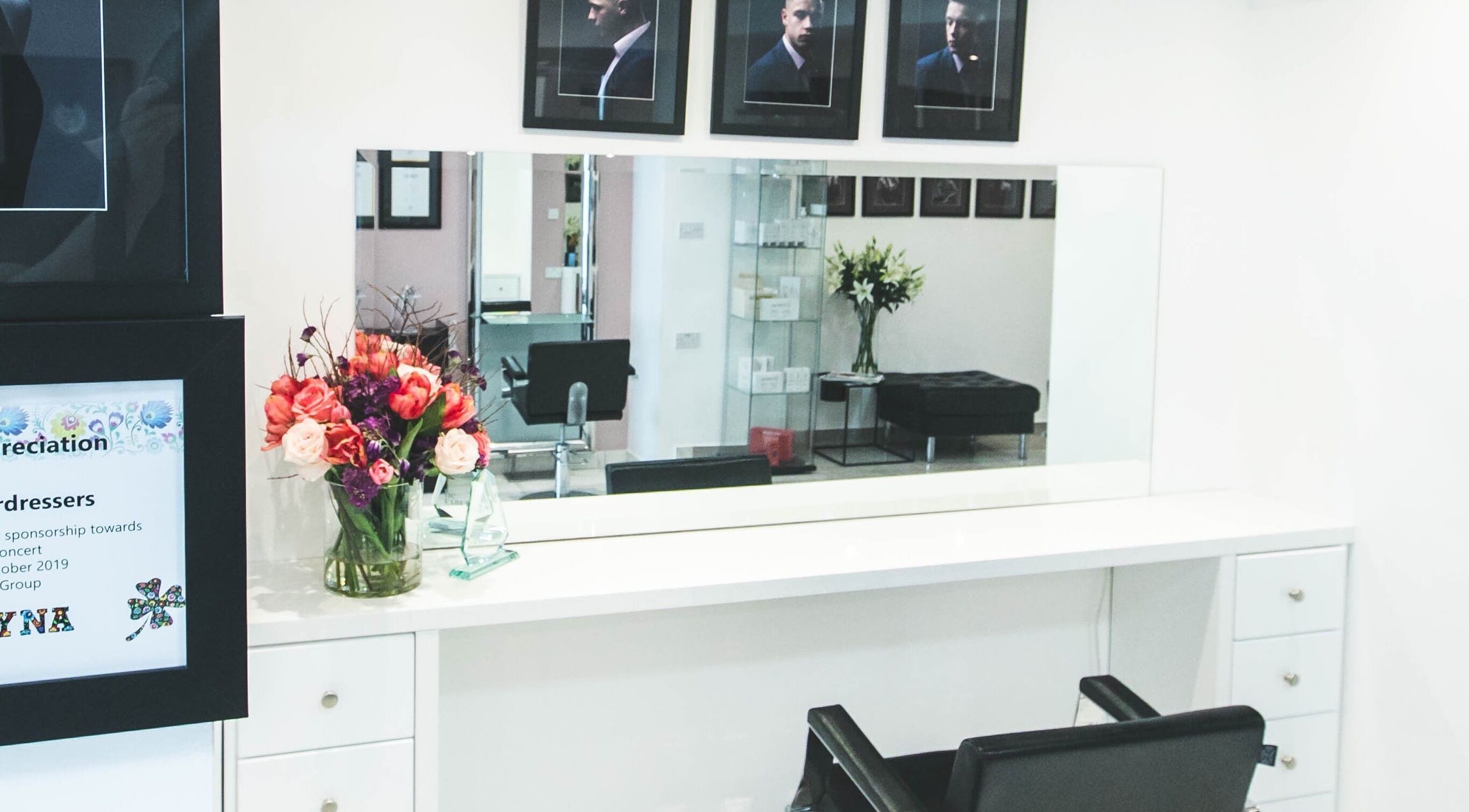 Elegant salon interior at Bozena Sarek Hairdressing Navan, featuring a stylish mirror and floral decor in Navan, County Meath, IE.