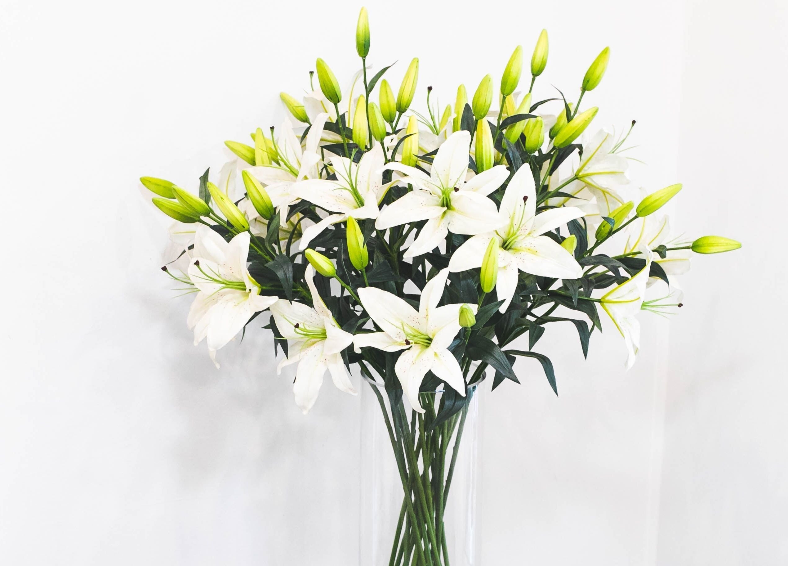 A vase of elegant white lilies at Bozena Sarek Hairdressing Navan, Navan, County Meath, IE, adding a touch of nature.