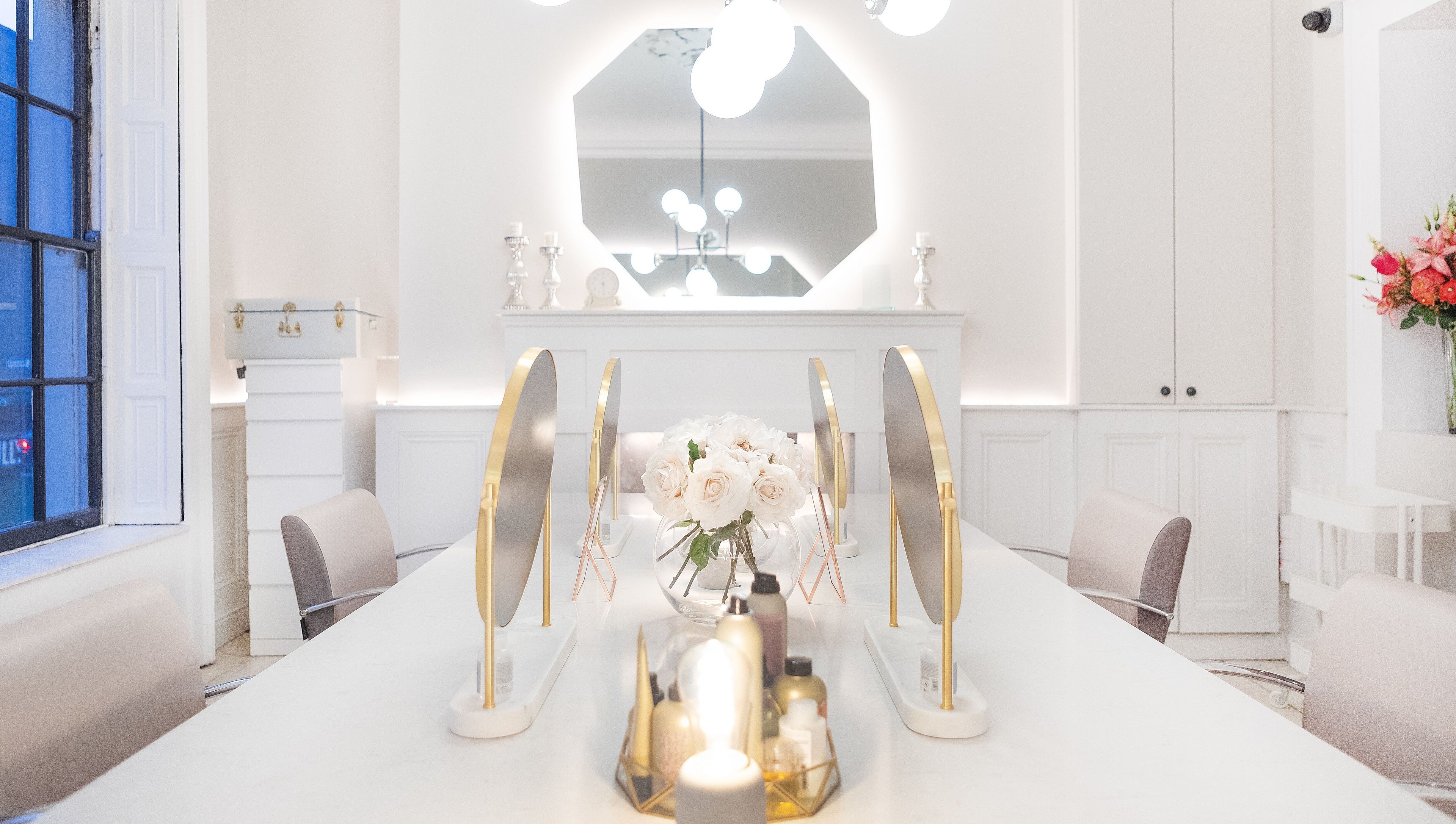 Chic interior of Bozena Sarek Hairdressing Dublin with stylish mirrors and floral decor in Dublin, County Dublin, IE.