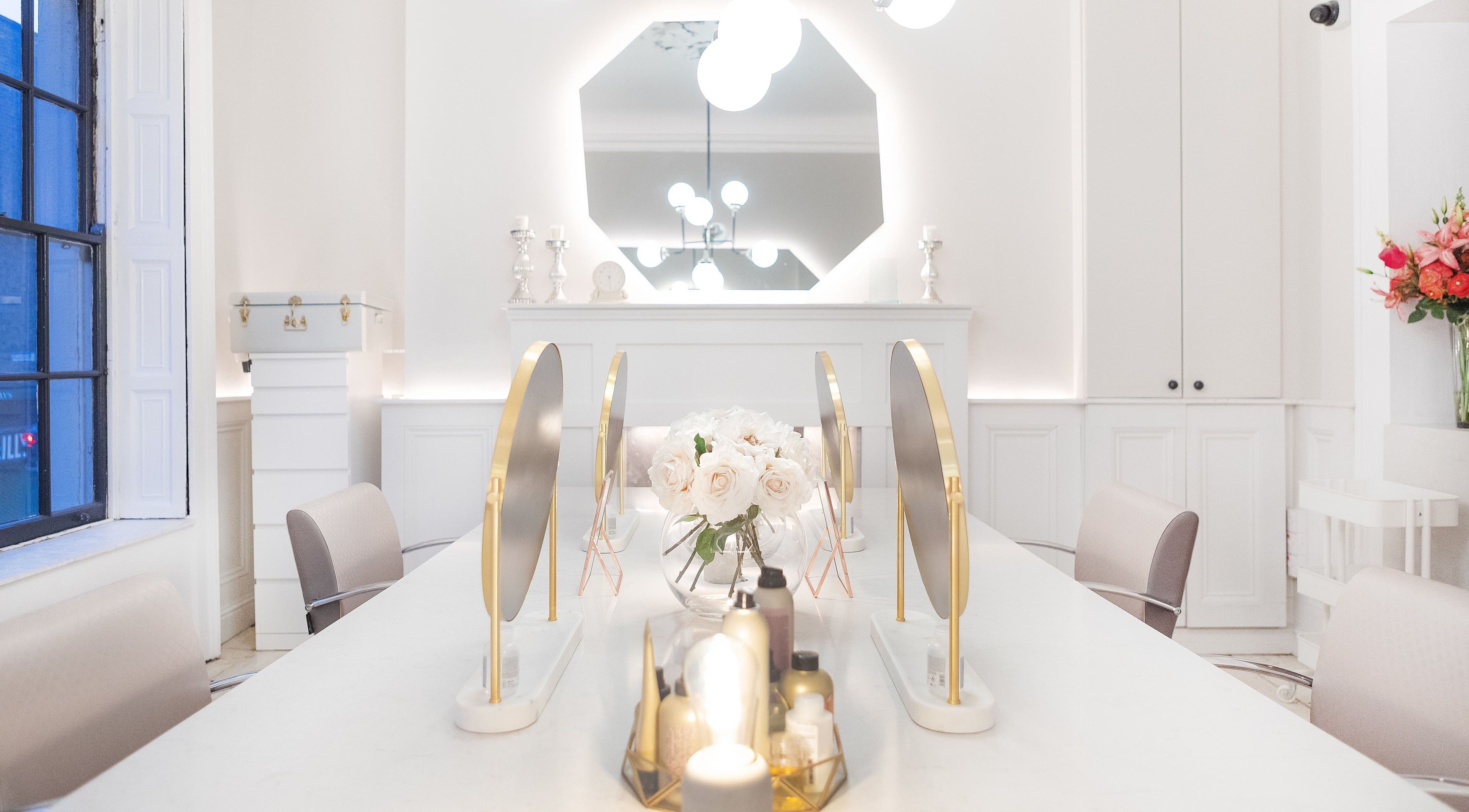 Chic interior of Bozena Sarek Hairdressing Dublin with stylish mirrors and floral decor in Dublin, County Dublin, IE.