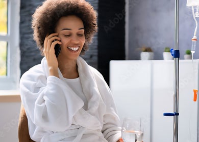 Woman enjoying IV therapy at IV DRIP LOUNGE BY SHAR in Walthamcross, England, GB.