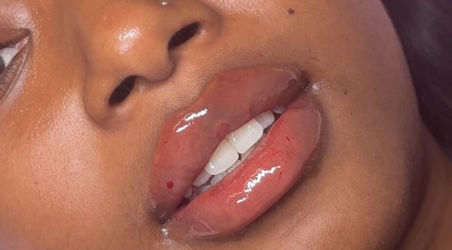 Close-up of glossy lips at Skin & Beauty By Ells, Luton, England, GB, showcasing expert lip care.
