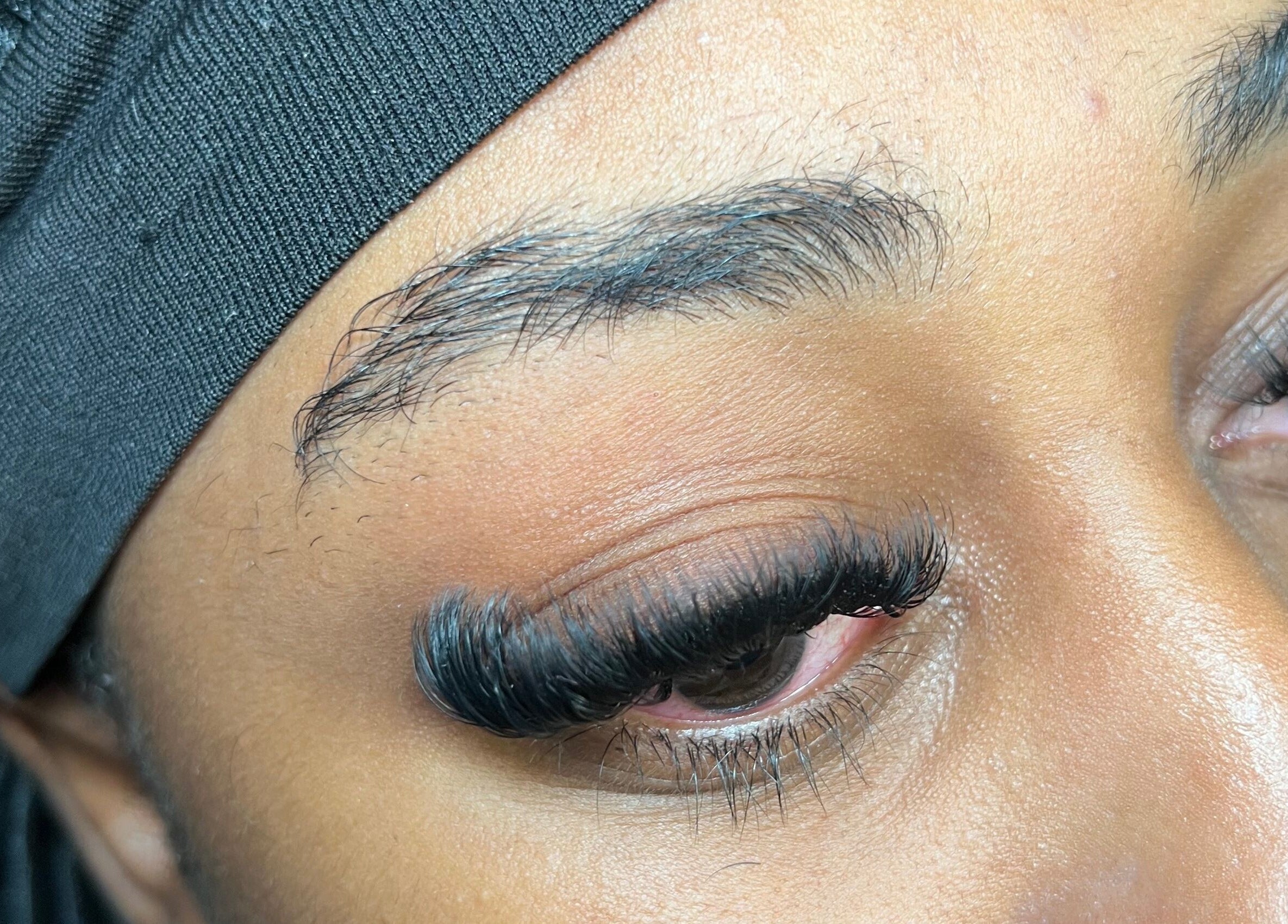 Close-up of expertly applied eyelash extensions at Skin & Beauty By Ells in Luton, England, GB.