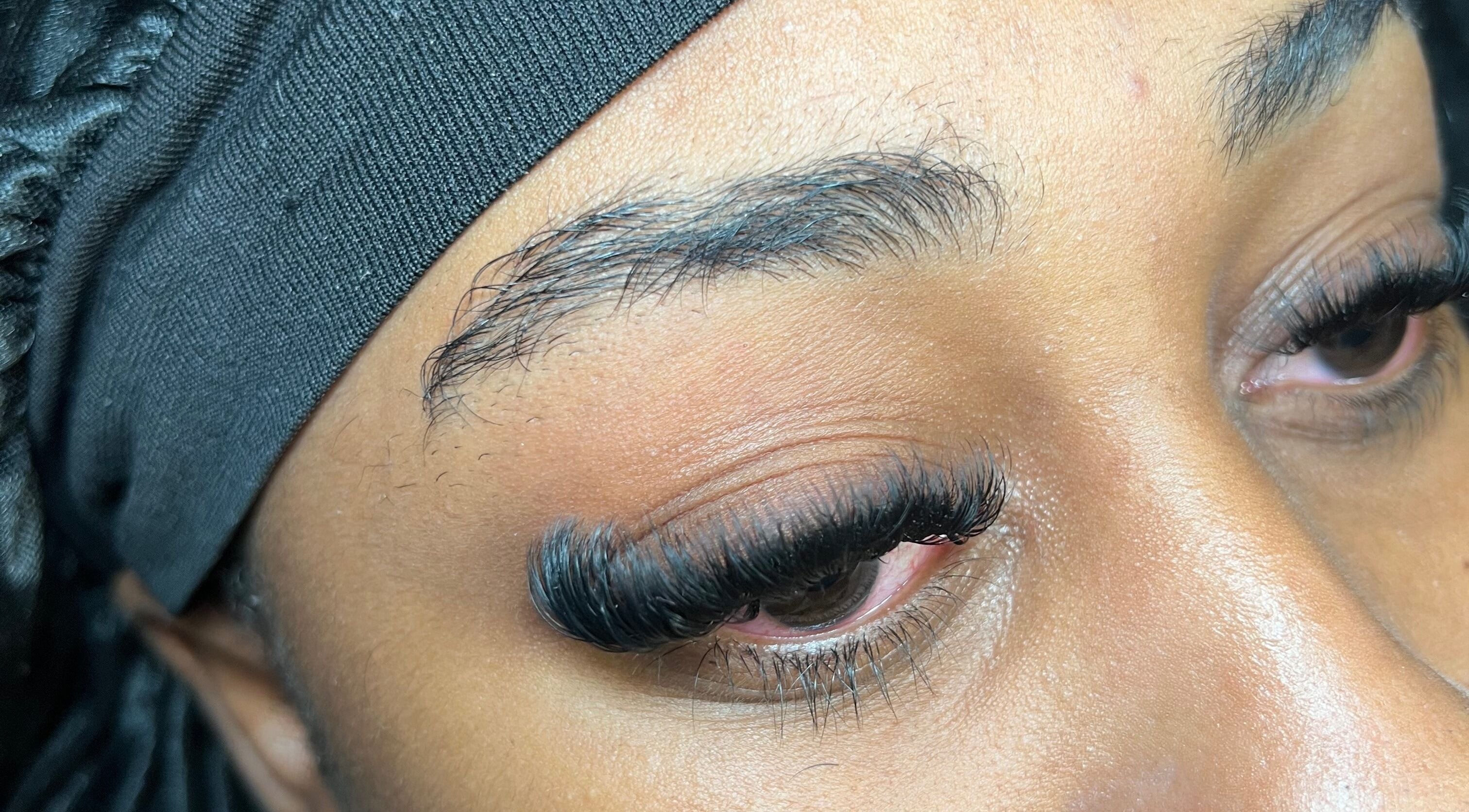 Close-up of expertly applied eyelash extensions at Skin & Beauty By Ells in Luton, England, GB.