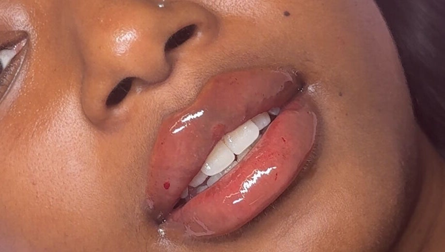 Close-up of glossy lips treatment at Skin & Beauty By Ells & Ella’s Luxe Aesthetics, Luton, England, GB.
