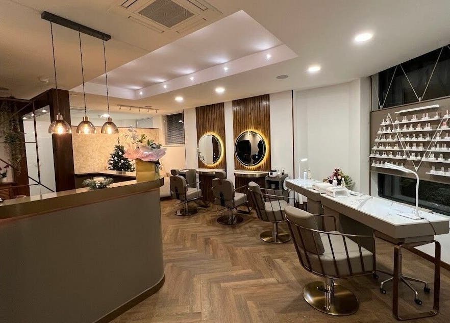 Modern and stylish salon interior of PK Aesthetic in Glasgow, Scotland, GB showcasing chic decor and mirrors.