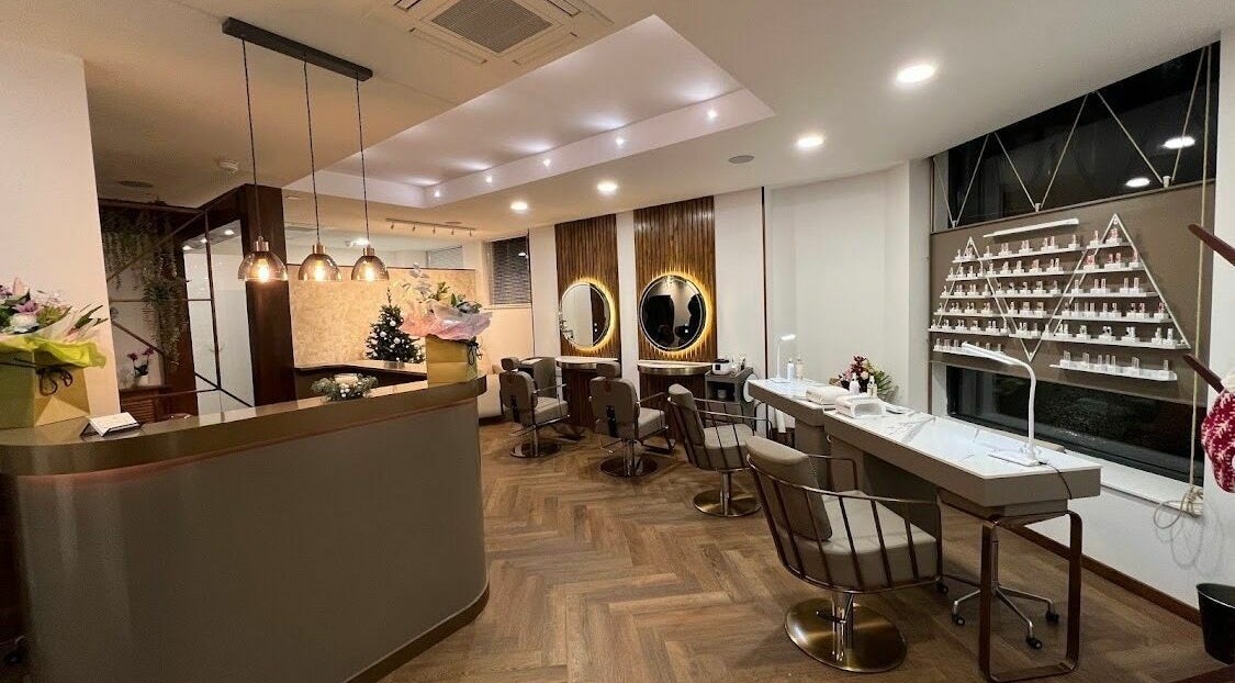 Modern and stylish salon interior of PK Aesthetic in Glasgow, Scotland, GB showcasing chic decor and mirrors.