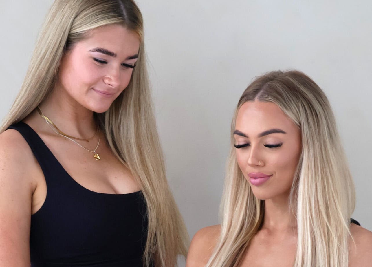 Stylists perfecting lash designs at The Lash Edit, Merrimac, Queensland, AU, showcasing beauty expertise.