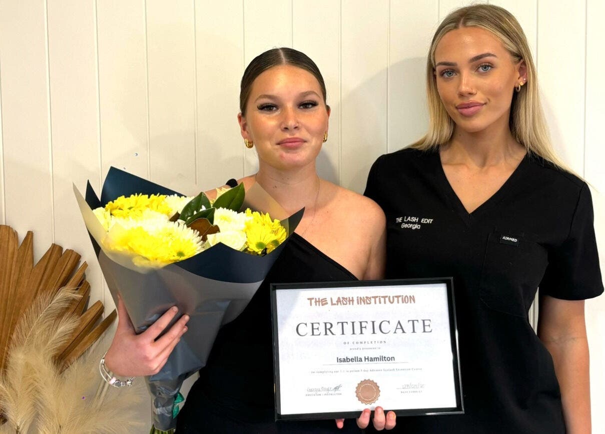 Two women with certificate at The Lash Edit, Merrimac, Queensland, AU.