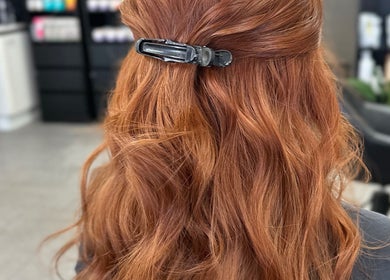 Stunning redhead styled at Natnicha's Hair Care, Kallangur, Queensland, AU. Elegant hair clip enhances waves.