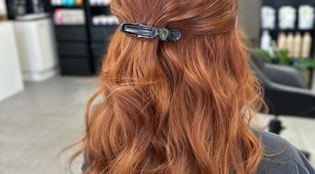 Stunning redhead styled at Natnicha's Hair Care, Kallangur, Queensland, AU. Elegant hair clip enhances waves.