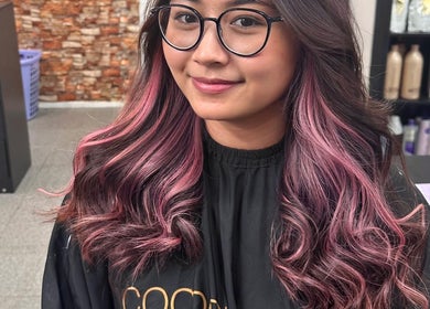 Stylish pink-highlighted hair at Natnicha's Hair Care in Kallangur, Queensland, AU.