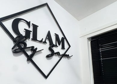 GlamBySam_x wall sign in Glasgow, Scotland, GB, showcasing modern beauty and wellness services.
