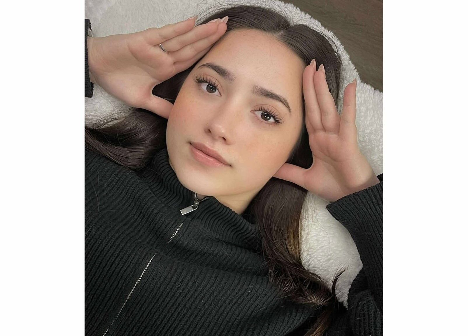 Relaxed client with styled lashes at Xynh Lash Studio, Granville, New South Wales, AU.