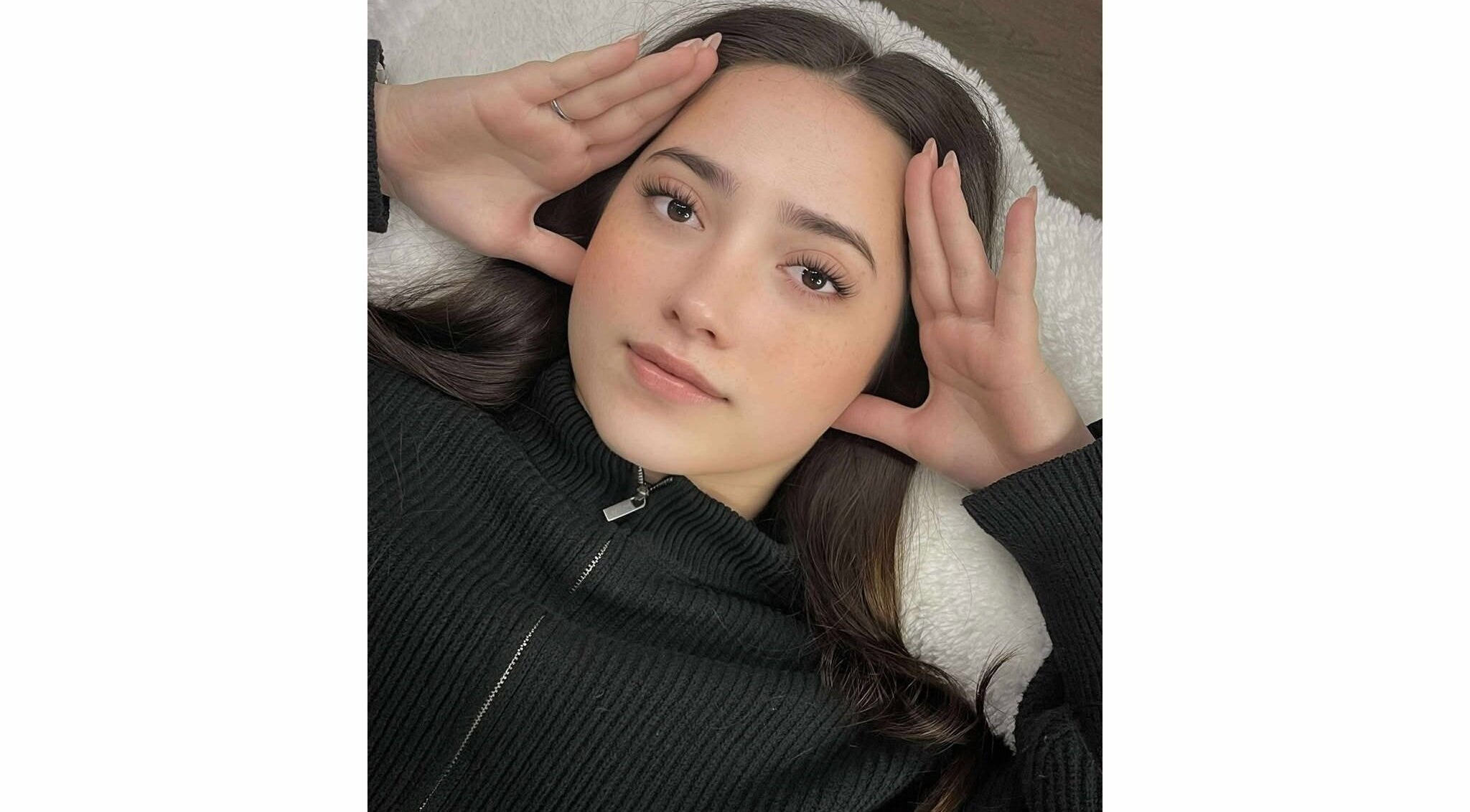 Relaxed client with styled lashes at Xynh Lash Studio, Granville, New South Wales, AU.