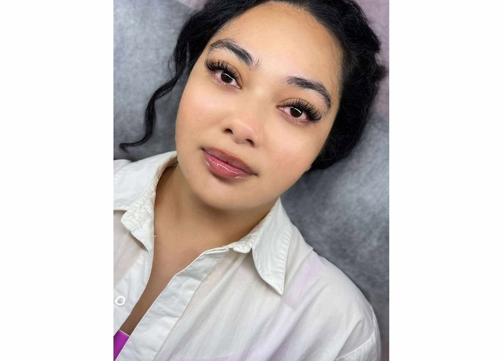 Woman showcasing eyelash extensions at Xynh Lash Studio, Granville, New South Wales, AU.