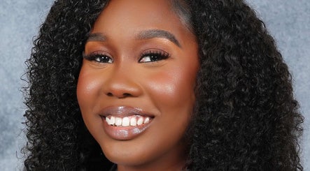 Close-up of a smiling woman at Beauty Refinery by Lia, Kingston 20, Kingston, JM.