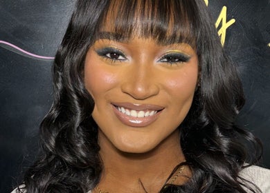 Smiling woman with stylish makeup at Beauty Refinery by Lia, Kingston 20, Kingston, JM.
