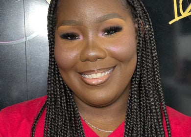 Smiling guest showcasing braid style at Beauty Refinery by Lia, Kingston 20, Kingston, JM.