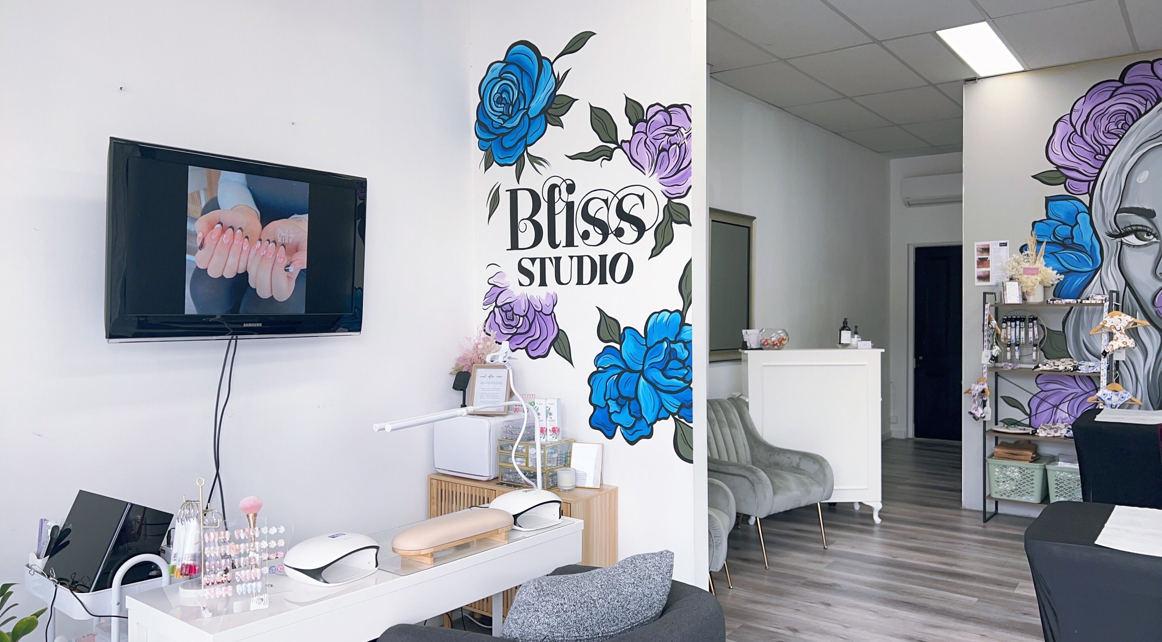 Interior of Bliss Lashes and Brows, Melbourne, Victoria, AU, featuring modern decor and floral wall art.