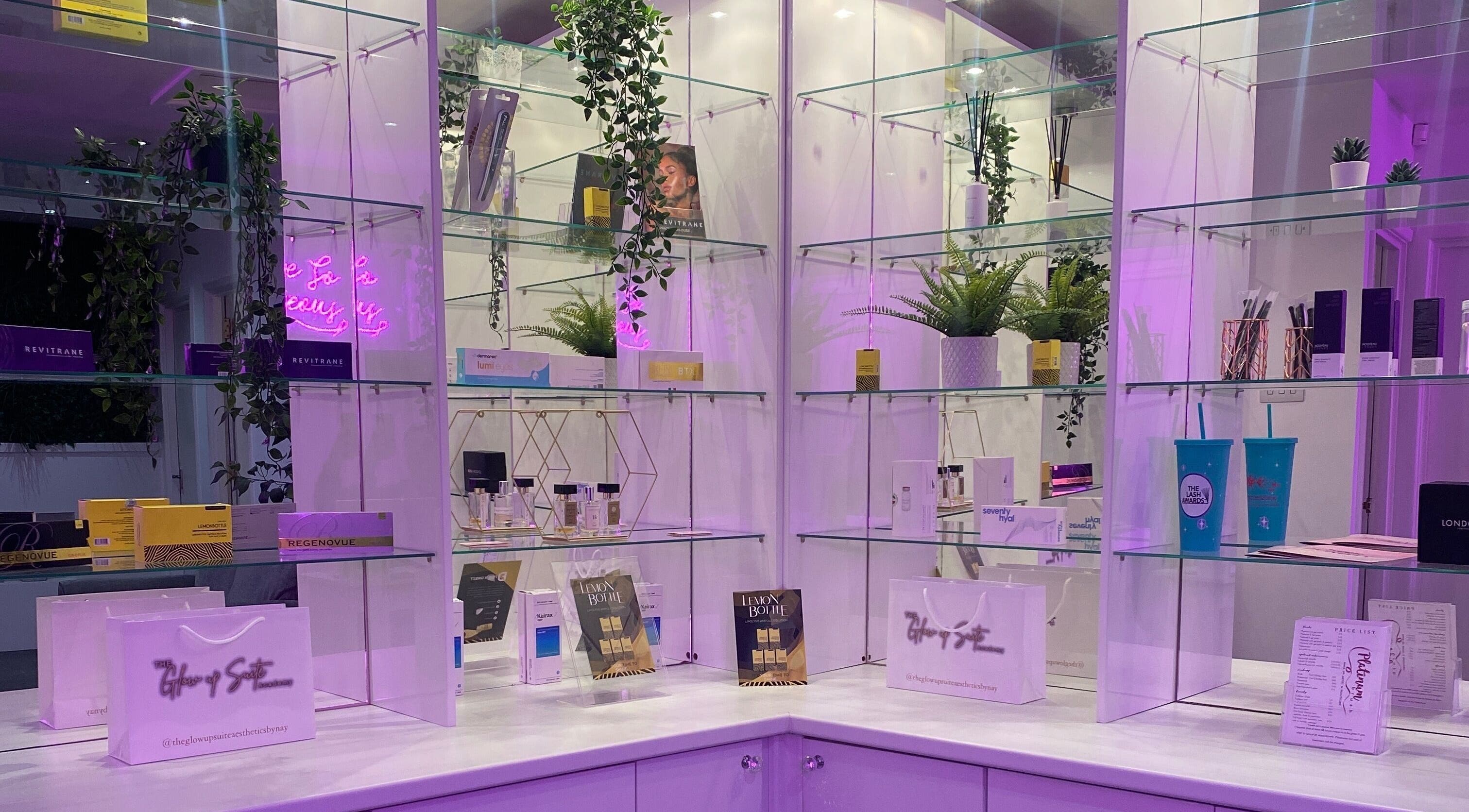 Stylish beauty product display at Platinum Brush Makeup and Beauty in Shepshed, England, GB, with lush greenery.