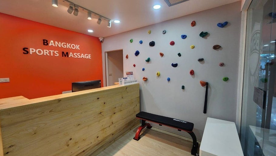 Reception area of Bangkok Sports Massage Silom in Bangrak, Bangkok, TH with colorful wall decor.