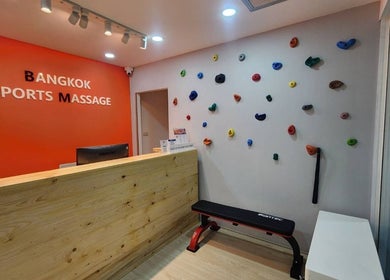Reception area of Bangkok Sports Massage Silom in Bangrak, Bangkok, TH with colorful wall decor.