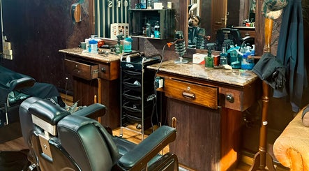 Barber station at Le Mirage, Doha, Doha Municipality, QA, featuring classic chairs and grooming tools.
