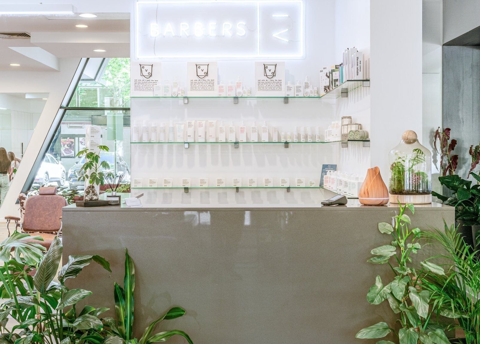 IV Barbers in Melbourne, Victoria, AU features a lush, welcoming interior with greenery and stylish decor.