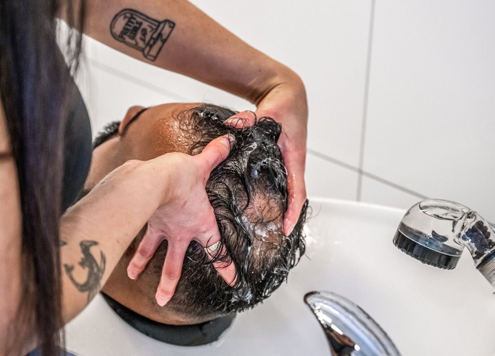 Relaxing hair wash at IV Barbers in Melbourne, Victoria, AU showcasing expert scalp massage.